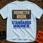 High Miles Higher Standards - T-Shirt in Chambray - A typographic design featuring the text "ODOMETER HIGH." in tan...