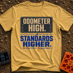High Miles Higher Standards - T-Shirt in Mustard - A typographic design featuring the text "ODOMETER HIGH." in tan...