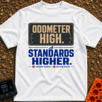 High Miles Higher Standards - T-Shirt in White - A typographic design featuring the text "ODOMETER HIGH." in tan letters...
