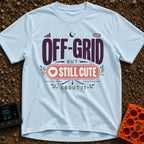 Off Grid But Cute - T-Shirt in Chambray - A typographic design reading "OFF-GRID BUT STILL CUTE ABOUT IT" featuring small...