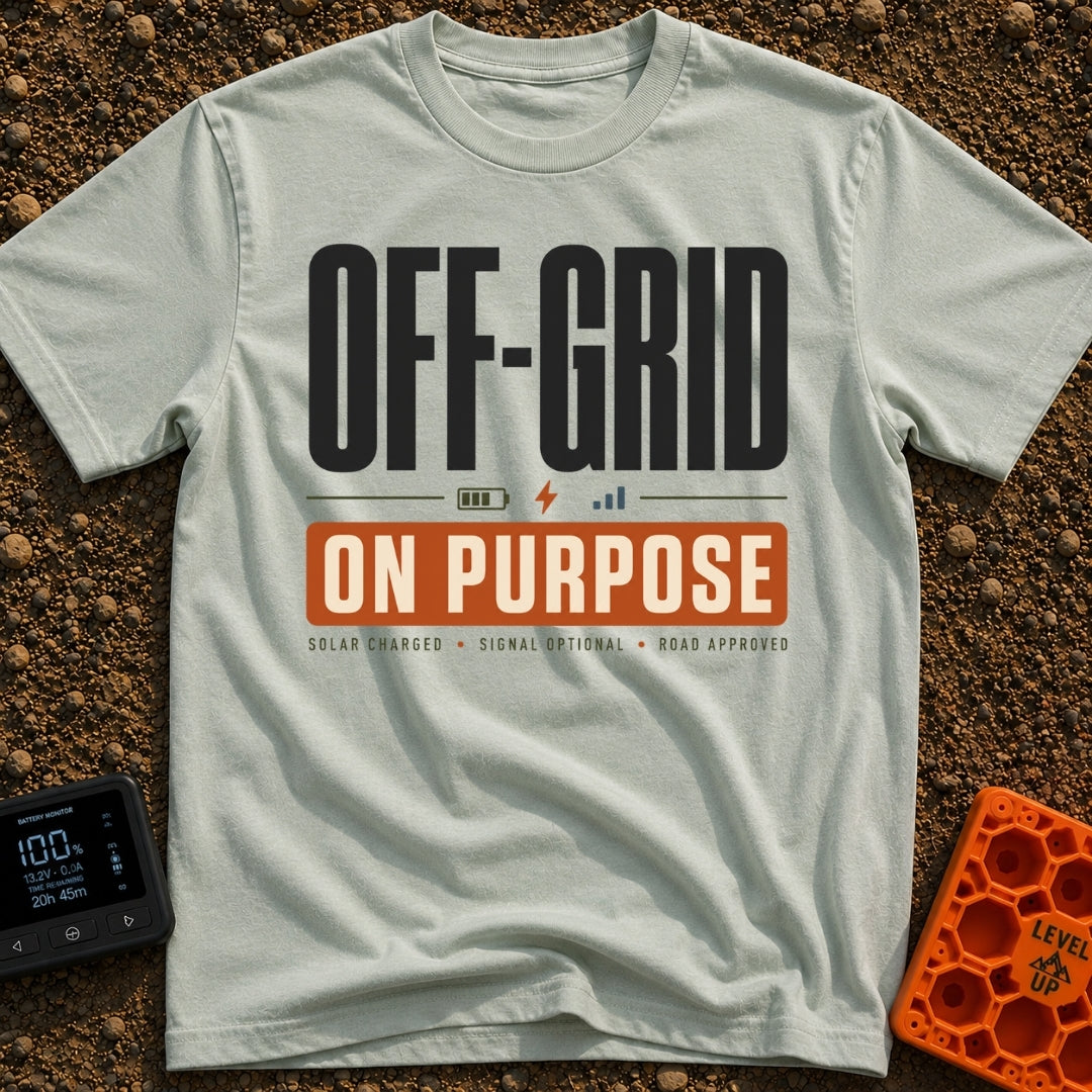 Off Grid On Purpose - T-Shirt in Bay - A typographic design reading "OFF-GRID" in large text above a battery, lightning...