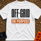 Off Grid On Purpose - T-Shirt in White - A typographic design reading "OFF-GRID" in large text above a battery, lightning...