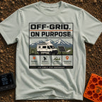 Off Grid On Purpose - T-Shirt in Bay - The artwork shows a white camper van parked in a mountainous landscape, surrounded...