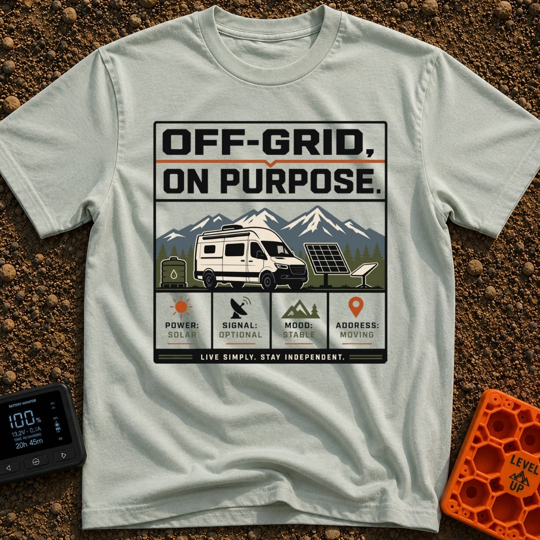 Off Grid On Purpose - T-Shirt in Bay - The artwork shows a white camper van parked in a mountainous landscape, surrounded...