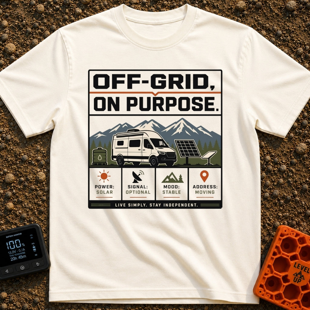 Off Grid On Purpose - T-Shirt in Ivory - The artwork shows a white camper van parked in a mountainous landscape,...