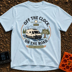 Off The Clock - T-Shirt in Chambray - A circular graphic featuring a white camper van with solar panels driving along a...