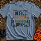 Out Of Office - T-Shirt in Blue Jean - A typographic design reading "OFFICE CLOSED. AMERICA OPEN." in bold block letters,...
