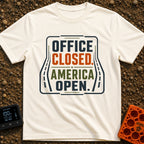 Out Of Office - T-Shirt in Ivory - A typographic design reading "OFFICE CLOSED. AMERICA OPEN." in bold block letters,...