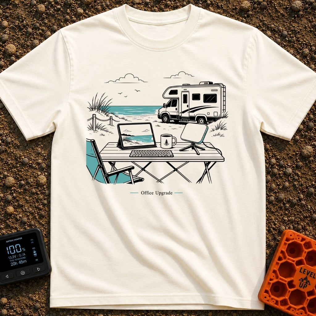 The New Corner Office - T-Shirt in Ivory - A line-art illustration of an outdoor workspace set up on a beach in front of...