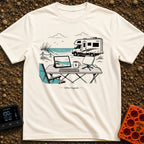 The New Corner Office - T-Shirt in Ivory - A line-art illustration of an outdoor workspace set up on a beach in front of...