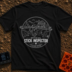 Stick It To’em - T-Shirt in Black - A line-art illustration of a large dog carrying a massive branch in its mouth in the...