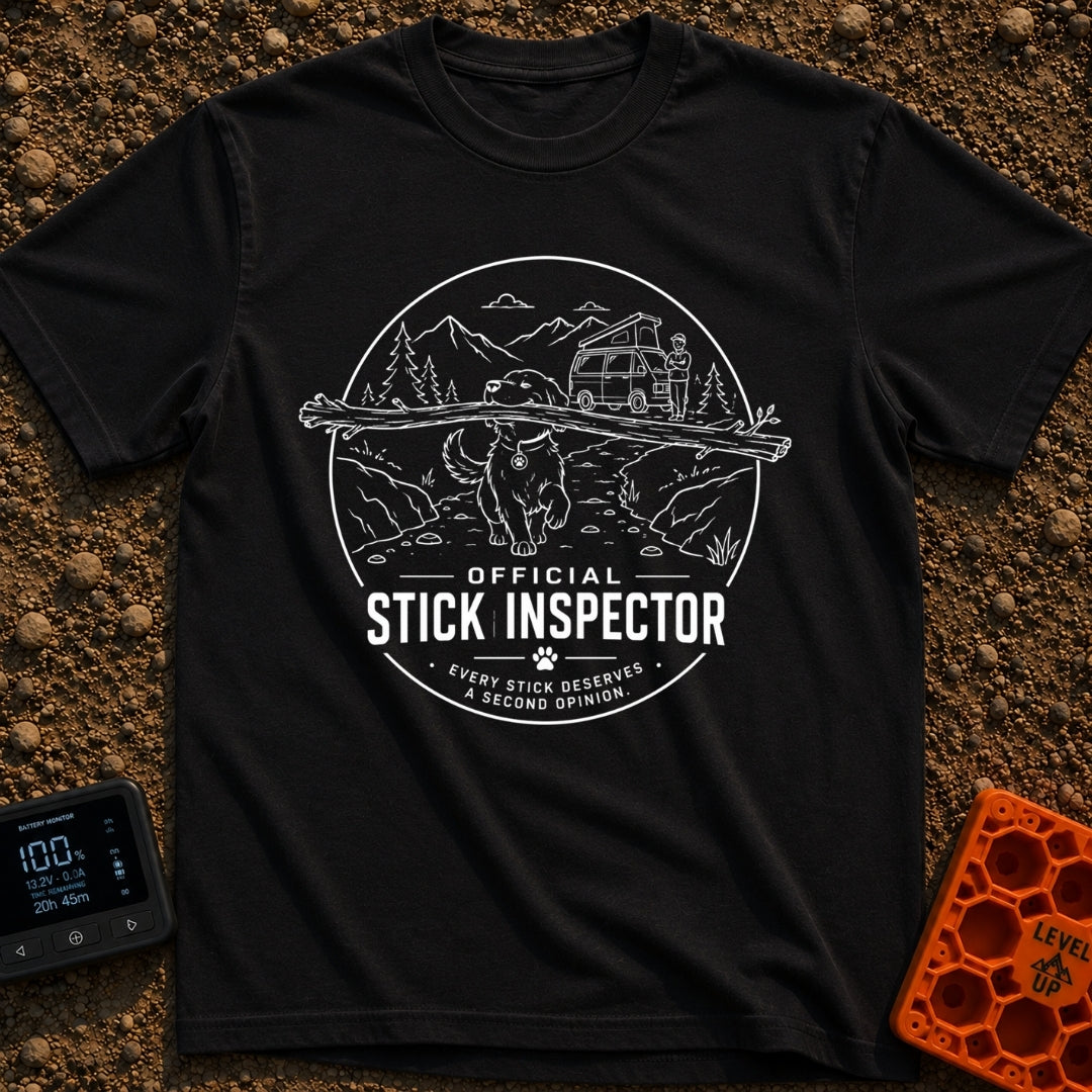 Stick It To’em - T-Shirt in Black - A line-art illustration of a large dog carrying a massive branch in its mouth in the...