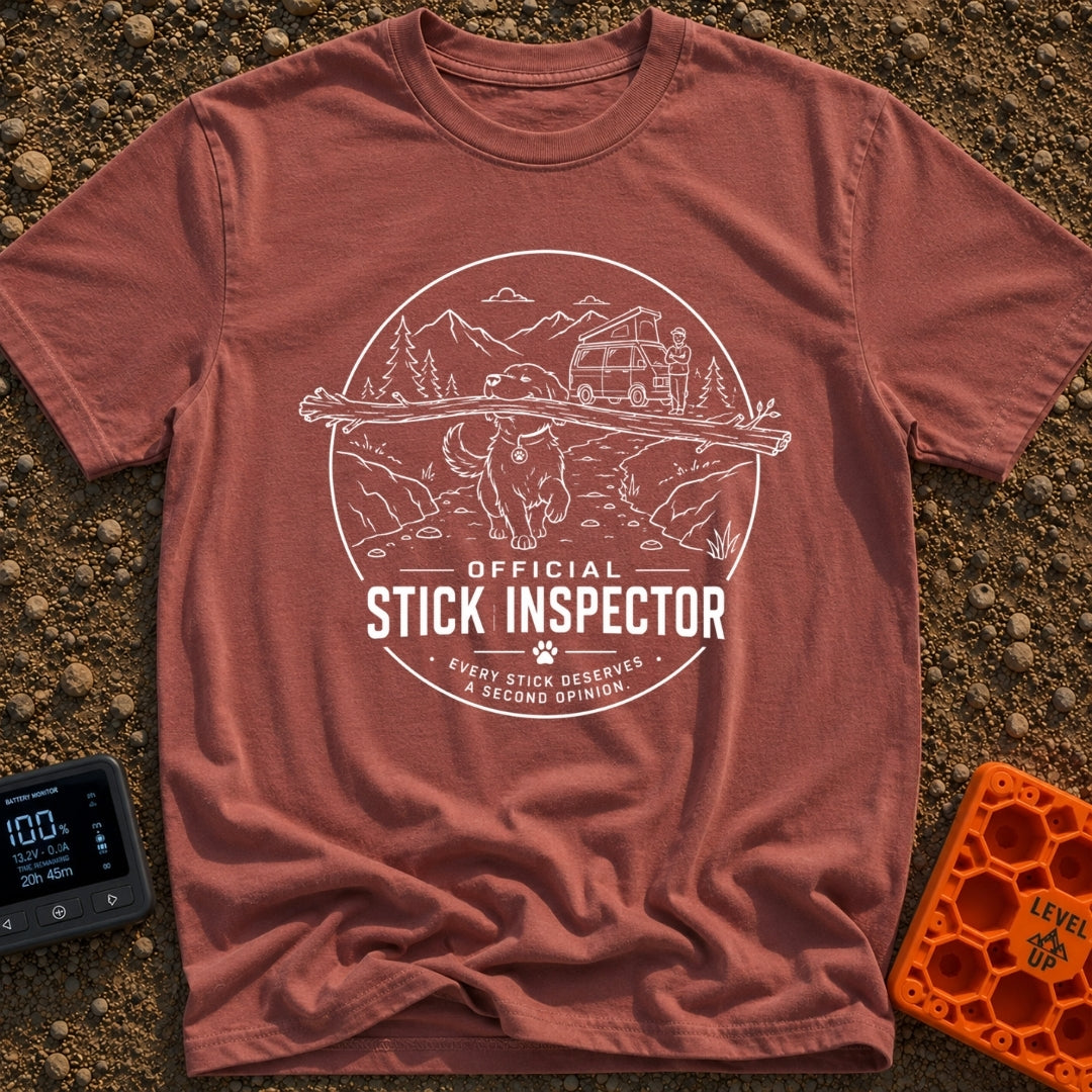 Stick It To’em - T-Shirt in Brick - A line-art illustration of a large dog carrying a massive branch in its mouth in the...