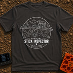 Stick It To’em - T-Shirt in Graphite - A line-art illustration of a large dog carrying a massive branch in its mouth in...