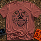 Chief Stick Officer - T-Shirt in Brick - A vintage-style circular badge design featuring a large paw print hovering over...