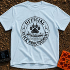 Chief Stick Officer - T-Shirt in Chambray - A vintage-style circular badge design featuring a large paw print hovering...