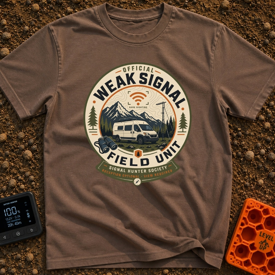 Weak Signal Field Unit - T-Shirt in Espresso - A round, badge-style illustration of a white camper van parked in a...
