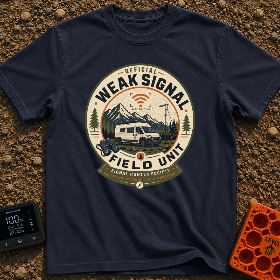 Weak Signal Field Unit - T-Shirt in Navy - A round, badge-style illustration of a white camper van parked in a...