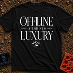 Offline Is Luxury - T-Shirt in Black - The design features the stacked text "OFFLINE IS THE NEW LUXURY" in an elegant...