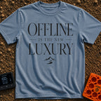 Offline Is Luxury - T-Shirt in Blue Jean - The design features the stacked text "OFFLINE IS THE NEW LUXURY" in an elegant...
