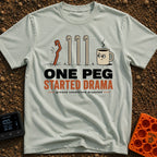One Peg Started Drama - T-Shirt in Bay - A cartoon illustration showing four tent pegs driven into the ground, with the...