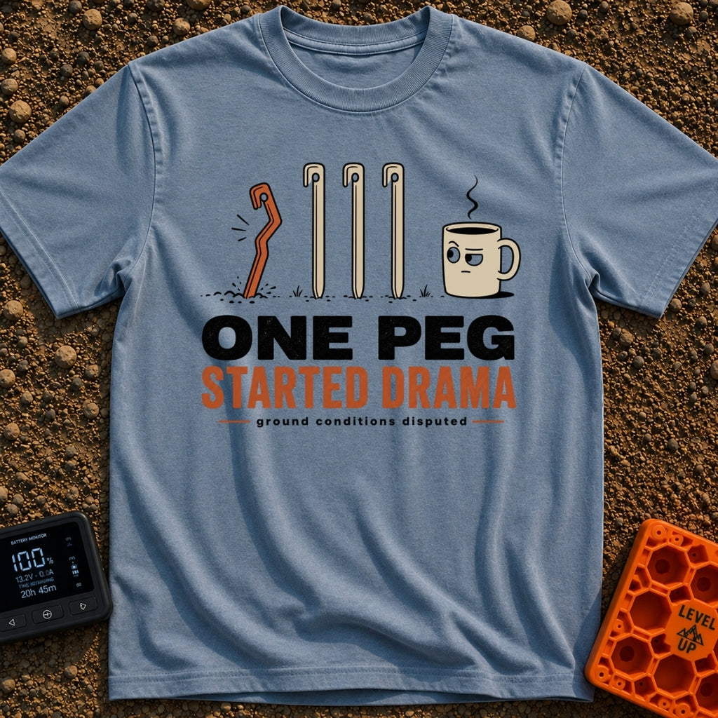 One Peg Started Drama - T-Shirt in Blue Jean - A cartoon illustration showing four tent pegs driven into the ground, with...