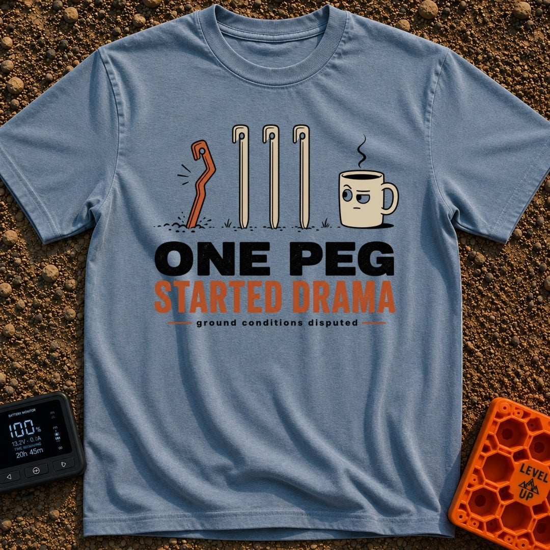 One Peg Started Drama - T-Shirt in Blue Jean - A cartoon illustration showing four tent pegs driven into the ground, with...