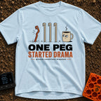One Peg Started Drama - T-Shirt in Chambray - A cartoon illustration showing four tent pegs driven into the ground, with...