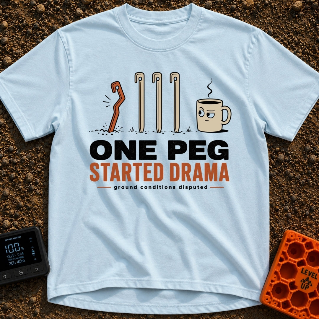 One Peg Started Drama - T-Shirt in Chambray - A cartoon illustration showing four tent pegs driven into the ground, with...