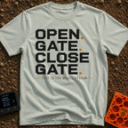 Designated Gate Opener - T-Shirt in Bay - A text-based design featuring the words 'OPEN. GATE. CLOSE. GATE.' stacked in...