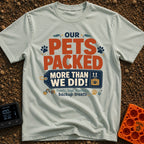 Our Pets Overpacked - T-Shirt in Bay - A typographic design featuring the text "OUR PETS PACKED MORE THAN WE DID!" with...
