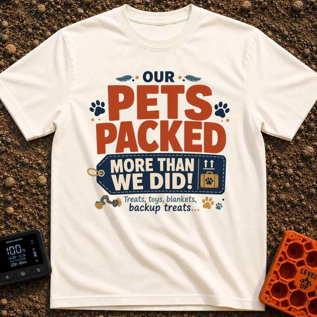 Our Pets Overpacked - T-Shirt in Ivory - A typographic design featuring the text "OUR PETS PACKED MORE THAN WE DID!" with...