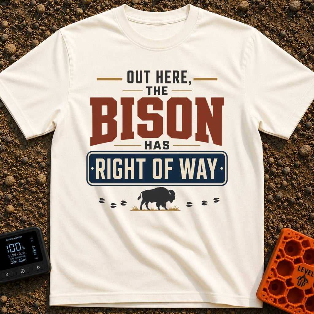 Bison Right Of Way - T-Shirt in Ivory - Text-based design reading "OUT HERE, THE BISON HAS RIGHT OF WAY" featuring a blue...