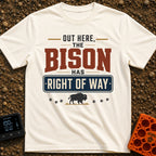 Bison Right Of Way - T-Shirt in Ivory - Text-based design reading "OUT HERE, THE BISON HAS RIGHT OF WAY" featuring a blue...