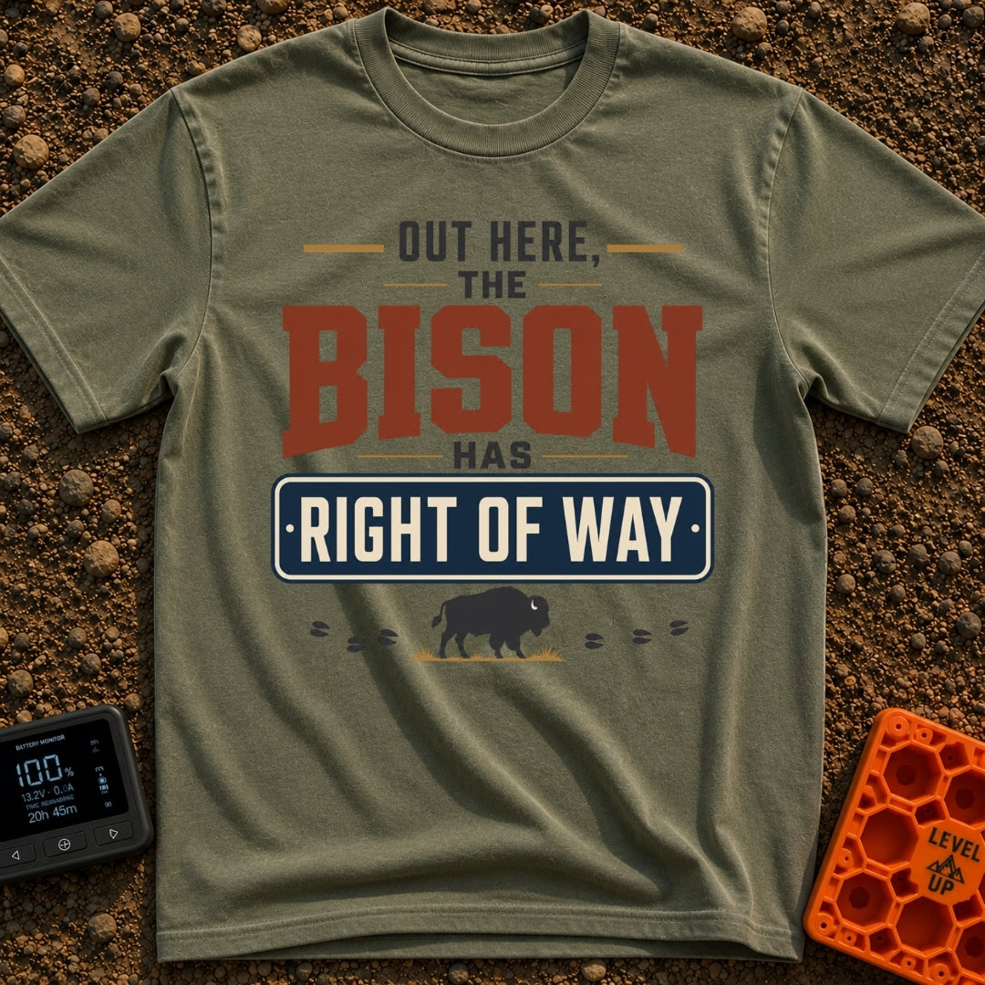 Bison Right Of Way - T-Shirt in Moss - Text-based design reading "OUT HERE, THE BISON HAS RIGHT OF WAY" featuring a blue...