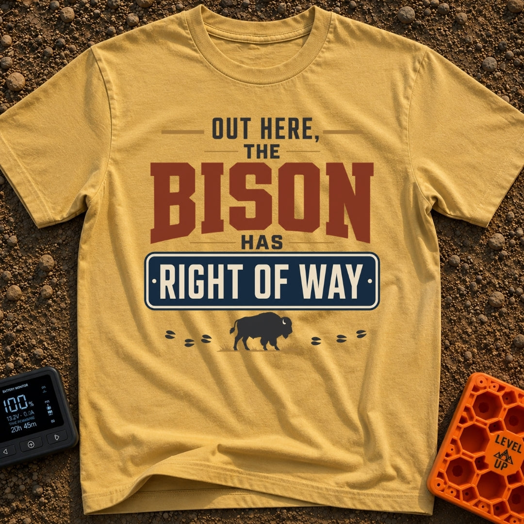 Bison Right Of Way - T-Shirt in Mustard - Text-based design reading "OUT HERE, THE BISON HAS RIGHT OF WAY" featuring a...