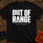 Happily Out Of Range - T-Shirt in Black - Typographic design featuring large, bold text reading "OUT OF RANGE" with a...