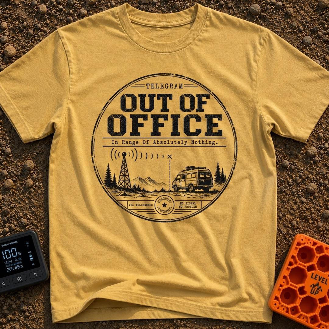 Off The Grid Telegram - T-Shirt in Mustard - A circular badge design featuring a camper van parked in a mountainous...