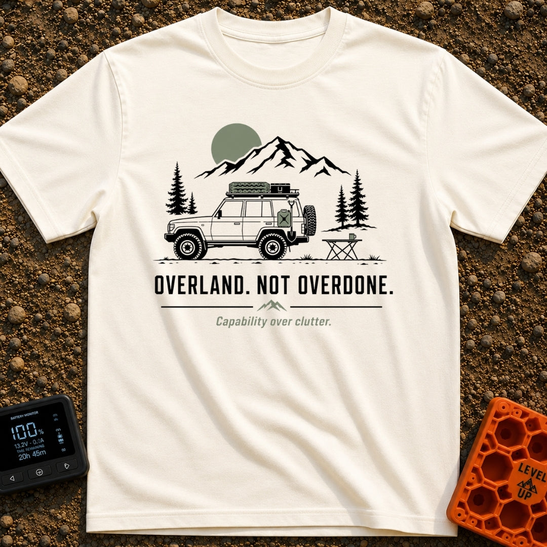Overland Not Overdone - T-Shirt in Ivory - A line drawing of a 4x4 SUV equipped with a roof rack, traction boards, jerry...