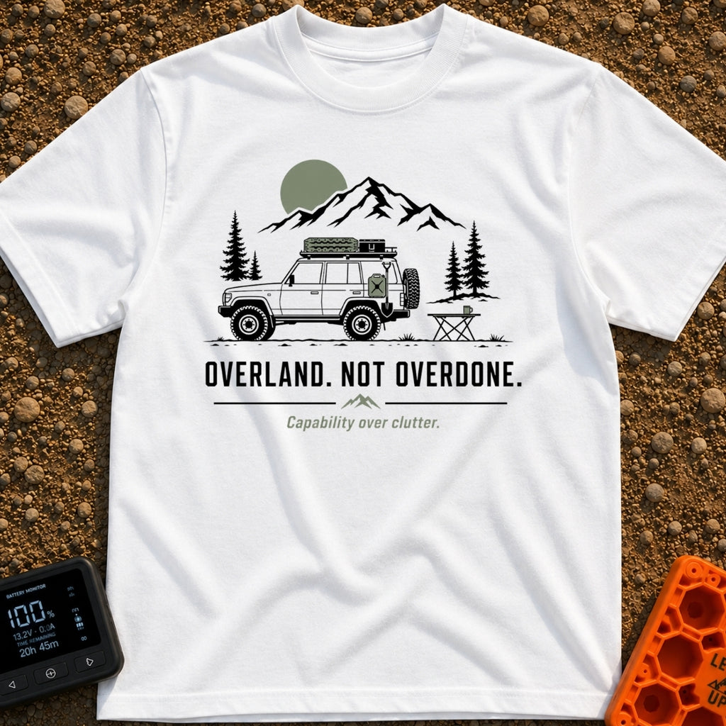 Overland Not Overdone - T-Shirt in White - A line drawing of a 4x4 SUV equipped with a roof rack, traction boards, jerry...