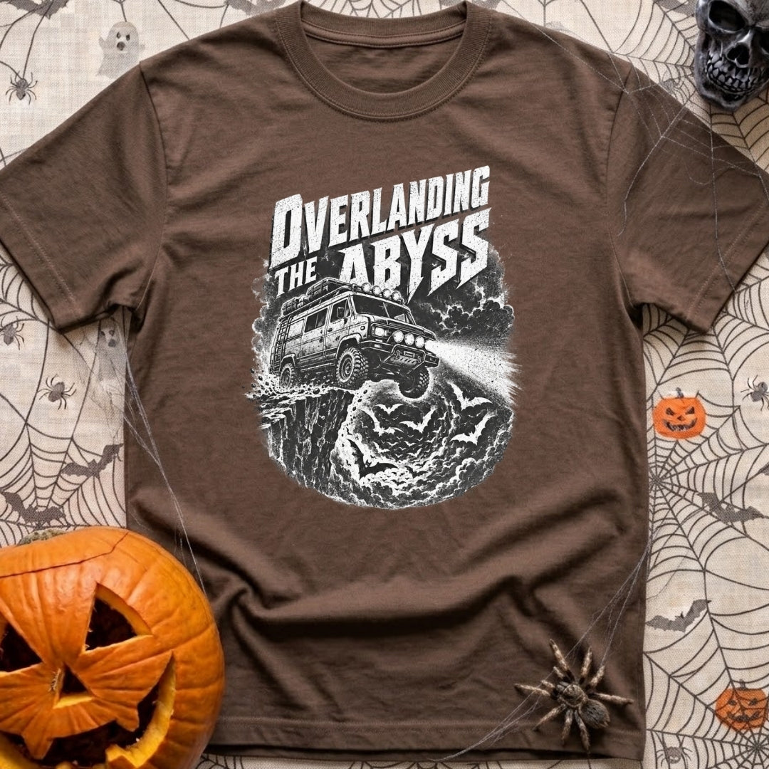Off The Deep End - T-Shirt in Espresso - A black and white illustration of a rugged 4x4 camper van driving off a rocky...
