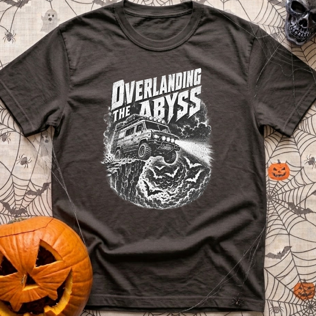 Off The Deep End - T-Shirt in Graphite - A black and white illustration of a rugged 4x4 camper van driving off a rocky...