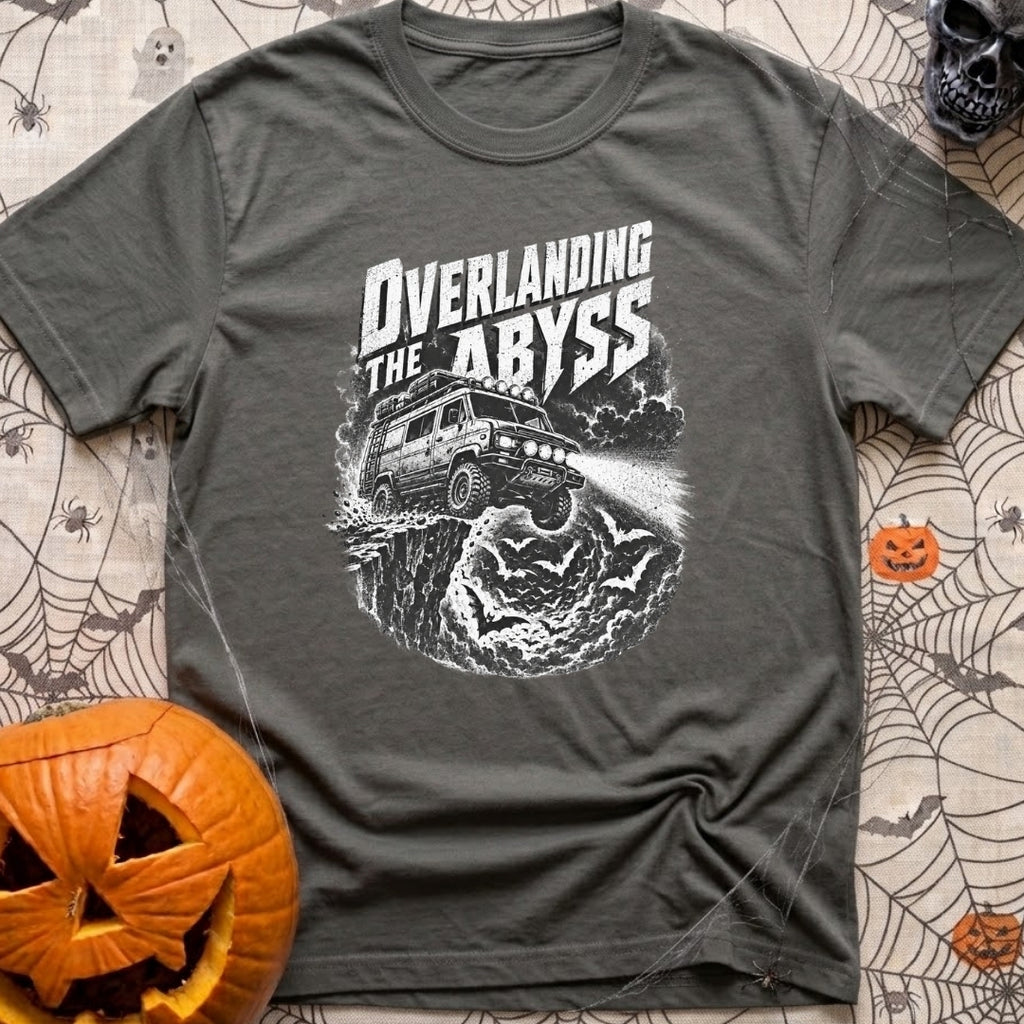 Off The Deep End - T-Shirt in Pepper - A black and white illustration of a rugged 4x4 camper van driving off a rocky...