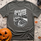 Off The Deep End - T-Shirt in Pepper - A black and white illustration of a rugged 4x4 camper van driving off a rocky...