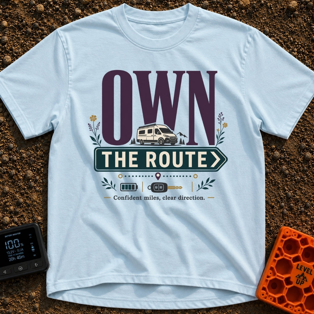 Own The Route - T-Shirt in Chambray - The design features the large text "OWN" behind a white camper van, with the words...