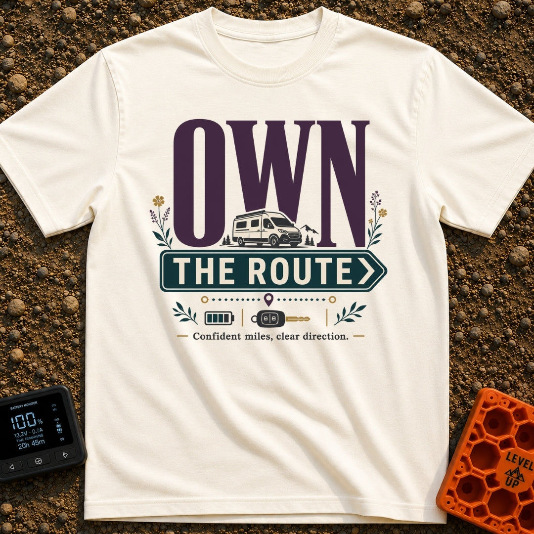 Own The Route - T-Shirt in Ivory - The design features the large text "OWN" behind a white camper van, with the words...