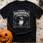 I Want To Connect - T-Shirt in Black - A vintage-style white line-art illustration of a ghost holding up a rectangular...