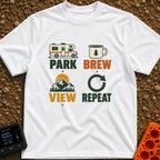 Brew View Repeat - T-Shirt in White - A four-part graphic design featuring a Class C motorhome above the word 'PARK', a...