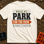 Parking With Purpose - T-Shirt in Ivory - A typographic design featuring the text 'RULE #2: PARK' and 'FOR THE VIEW'...