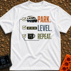 Park Level Repeat - T-Shirt in White - A three-step checklist graphic featuring the words "PARK.", "LEVEL.", and...